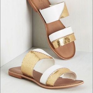 White & gold sandals
